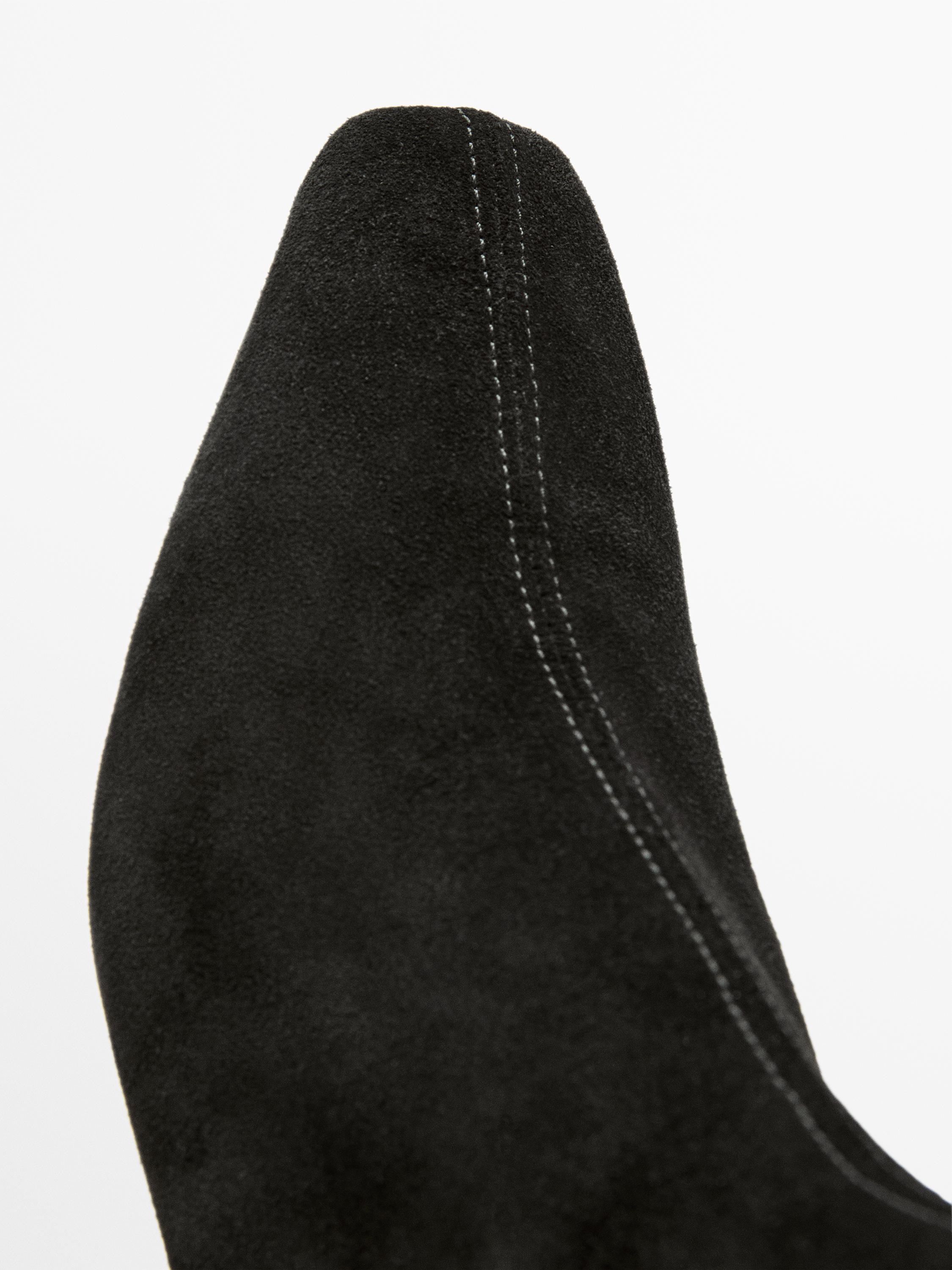 Bottines compensées en croûte de cuir